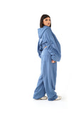 TUTA CALLIOPE BLU CLAIR CON CAPPUCCIO E MANICHE ARRICCIATE